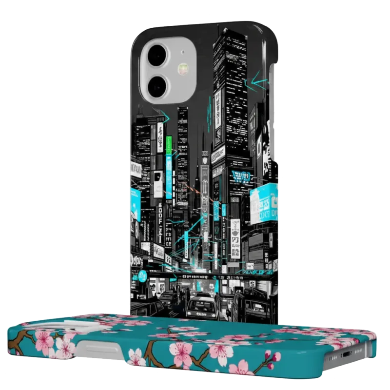 Two iPhone cases displayed against a solid white background: one standing upright with a black and white cyberpunk city illustration, and one lying flat with a teal cherry blossom floral pattern.